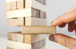 bigstock-The-tower-from-wooden-blocks--115717643.jpg