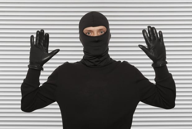 bigstock-Thief-with-balaclava-caught-in-104568938.jpg